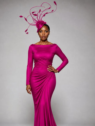 Magenta fascinator with sweeping feathers catching light
