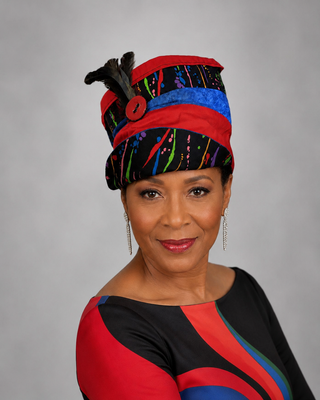 Black Hat with Bold Multicolor Print & Feather Accent